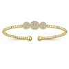 This 14k yellow gold cuff style bangle bracelet features one third carats of diamond shine.