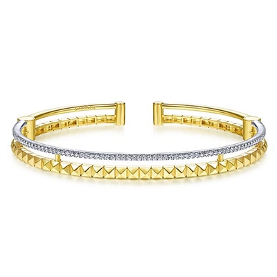 This 14k two tone cuff bangle features one half carats of diamonds.