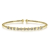 11 Round brilliant diamonds glisten in this 14k yellow gold beaded bangle bracelet.