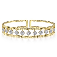 This uniquely styled diamond cuff bangle features nearly three quarters carats of diamond shine.