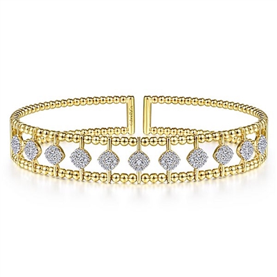 This uniquely styled diamond cuff bangle features nearly three quarters carats of diamond shine.