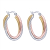 14k white gold mixes with rose and yellow gold is met with diamonds in these hoop earrings.