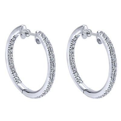 14k white gold mixes with round brilliant diamonds to create this contemporary take on the classic diamond hoop earring!