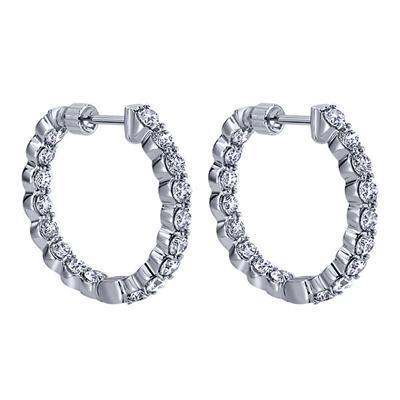 This 14k white gold diamond hoop pair of earrings features 1.98 carats of round brilliant diamonds shining all around this 14k white gold hoop setting.