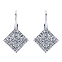 Rows of diamond shine surround a centerpiece of a bezel set round diamond in this 14k white gold pair of diamond drop earrings.