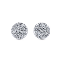 Set in a cluster style setting, 0.11 carats of diamonds in 14k white gold stud earrings.