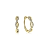 This pair of 14k yellow gold diamond hoop earrings features 0.11 carats of diamond shine.