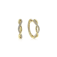 This pair of 14k yellow gold diamond hoop earrings features 0.11 carats of diamond shine.