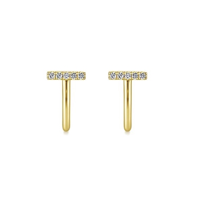 This 14k yellow gold pair of j curve stud earrings features shimmering diamonds.