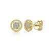 This pair of `4k yellow gold diamond stud earrings feature diamond accents floating in a beaded halo.