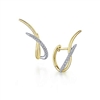 Diamonds cross over 14k yellow gold in these two tone diamond huggie style earrings.