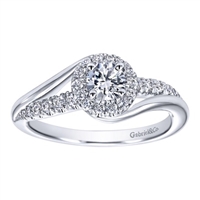 This freely styled round diamond engagement ring set up for a round center diamond shimmers with with one quarter carats of round brilliant diamonds is available in white gold or platinum.