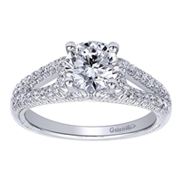 This wonderfully set round diamond split shank diamond engagement ring shimmers and glistens with over one quarter carats of round brilliant diamonds and is offered to you in white gold or platinum.