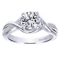 This fresh and modern take on a diamond engagement ring features a split shank to house a round center diamond, in white gold or platinum.
