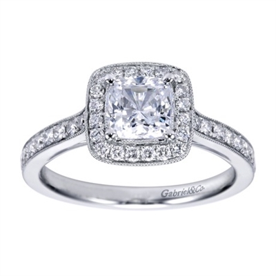 This cushion cut halo diamond engagement ring is dripping with over one third carats of round brilliant diamonds, available in white gold or platinum!