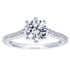 This magnificent diamond engagement ring features a melody of round brilliant diamonds that climb their way to a beautiful and open diamond basket, that hols a one carat center diamond.
