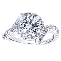 Three quarters of a carat of round brilliant diamonds swim around a gorgeous center diamond of your choice in this sexy and unique diamond engagement ring,