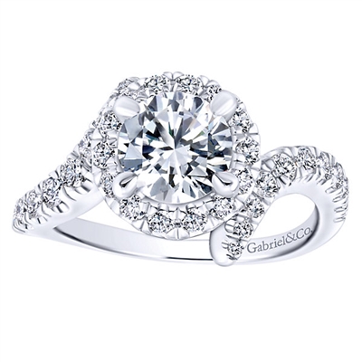 Three quarters of a carat of round brilliant diamonds swim around a gorgeous center diamond of your choice in this sexy and unique diamond engagement ring,