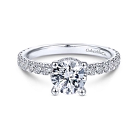 This diamond basket halo engagement ring features over one half carats of diamond shine.