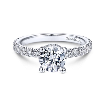 This diamond basket halo engagement ring features over one half carats of diamond shine.