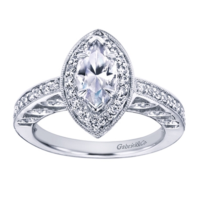 In white gold or platinum, this marquise halo engagement ring sparkles with one half carat in round brilliant diamonds lights up the whole room.