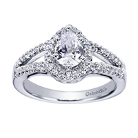 A center pear diamond sits perfectly in this split shank white gold or platinum contemporary halo engagement ring with round brilliant diamonds.