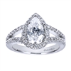 Platinum bands come together to form a pear shaped halo in this platinum split shank pear diamond halo engagement ring.