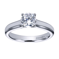 Sometimes a round center diamond just needs to be left alone! With this contemporary solitaire engagement ring will let that round center diamond shine.