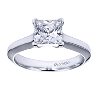 What more could anyone ask for than a beautifully cut princess diamond with a polished band in white gold or platinum in this contemporary solitaire engagement ring.