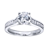 Round brilliant diamonds nestle into a contemporary straight engagement ring in your choice of white gold and platinum.