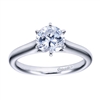 White gold or platinum bands rise towards the center of this solitaire engagement ring with a contemporary finish.