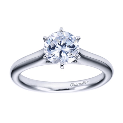 White gold or platinum bands rise towards the center of this solitaire engagement ring with a contemporary finish.