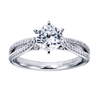 Intricately set round brilliant diamonds shimmer and glisten, setting up a round center diamond in the midst of one quarter carats of diamonds in this platinum split shank diamond engagement ring.