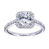 This striking and unique 14k white gold diamond halo engagement ring comes with nearly one half carat of scintillating round brilliant diamonds, with a simple setting to keep your eyes on the round center diamond of your choice!
