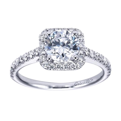 This striking and unique 14k white gold diamond halo engagement ring comes with nearly one half carat of scintillating round brilliant diamonds, with a simple setting to keep your eyes on the round center diamond of your choice!