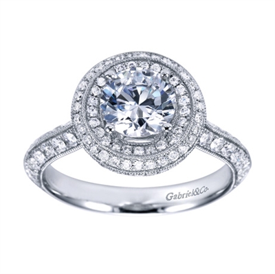 This white gold engagement ring has double rows of round diamonds to accent a round center diamond in this contemporary halo engagement ring.