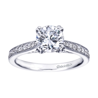 A simple design with an over the top look! this contemporary engagement ring in white gold is sure to impress.