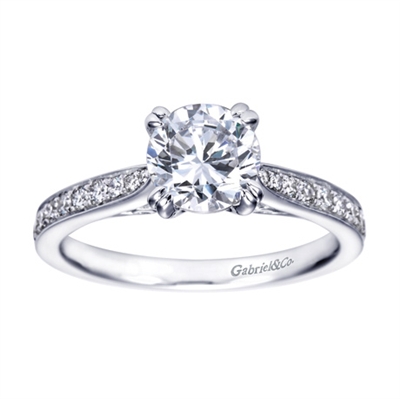 A simple design with an over the top look! this contemporary engagement ring in white gold is sure to impress.