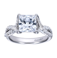 A princess cut center diamond sits in the middle of criss cross split shank bands, all covered in round brilliant diamonds in this platinum criss cross engagement ring.