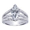 This marquise shaped diamond split shank engagement ring features nearly one carat of round brilliant diamonds is offered in white gold or platinum.