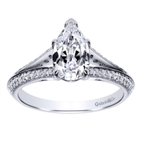 This diamond encrusted engagement ring holds a pear cut center diamond and holds 1/3  carats of round diamonds in its split shank diamond engagement ring setting.