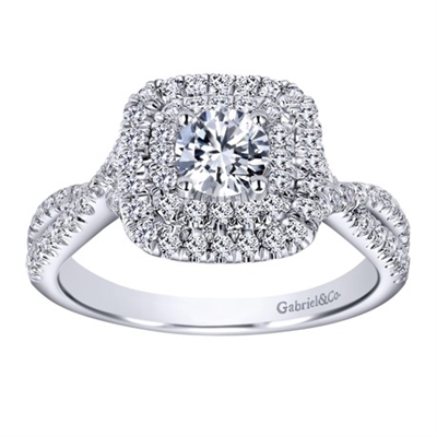 Squared off double rows of round brilliant diamonds surround a beautiful round center diamond in this double diamond halo engagement ring in white gold!
