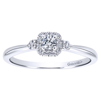 This 14k white gold petite diamond halo engagement ring is studded with 0.19 carats in round brilliant diamonds is a simple and sleek diamond engagement ring that makes a clear message.
