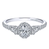 This 14k white gold diamond promise ring features nearly 3/4 carats of diamonds in an elegant style.