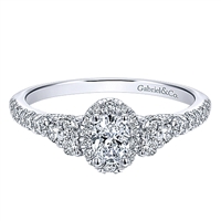 This 14k white gold diamond promise ring features nearly 3/4 carats of diamonds in an elegant style.