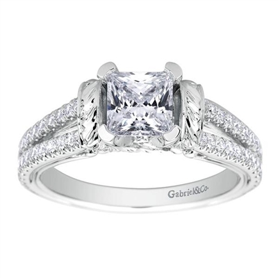 This diamond studded split shank princess cut diamond engagement ring glistens with 0.39 carats of round brilliant diamonds, all cushioning a princess cut center diamond.