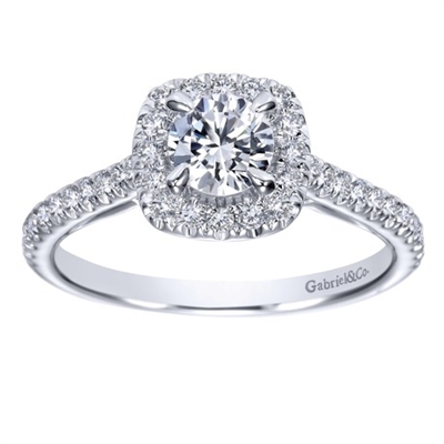 This round brilliant diamond halo engagement ring features a round center diamond and side round diamonds all included in this engagement ring!
