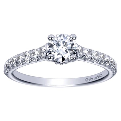 This chic and stylish straight round diamond engagement ring comes complete with a round center diamond that delivers the message.