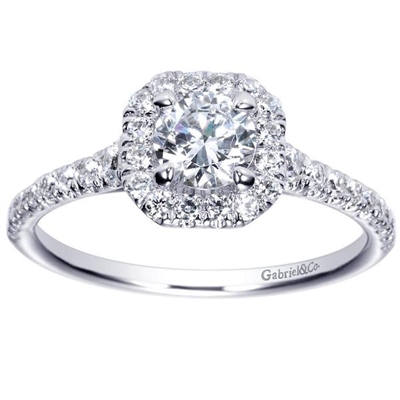 This 14k white gold diamond engagement ring uses round brilliant diamonds and a diamond halo to make its message! With 3/4 carats of round diamonds laid over sleek white gold the message is loud and clear!