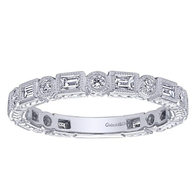 Round brilliant diamonds interlace with baguette cut diamonds to create a unique style in this 14k white gold round and baguette diamond stackable ring.